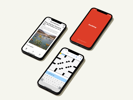 three phones: one has a news story, one has a crossword, and one has a red background with the word "cooking"