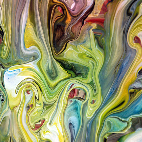 a canvas that has had various colors of paint poured onto it
